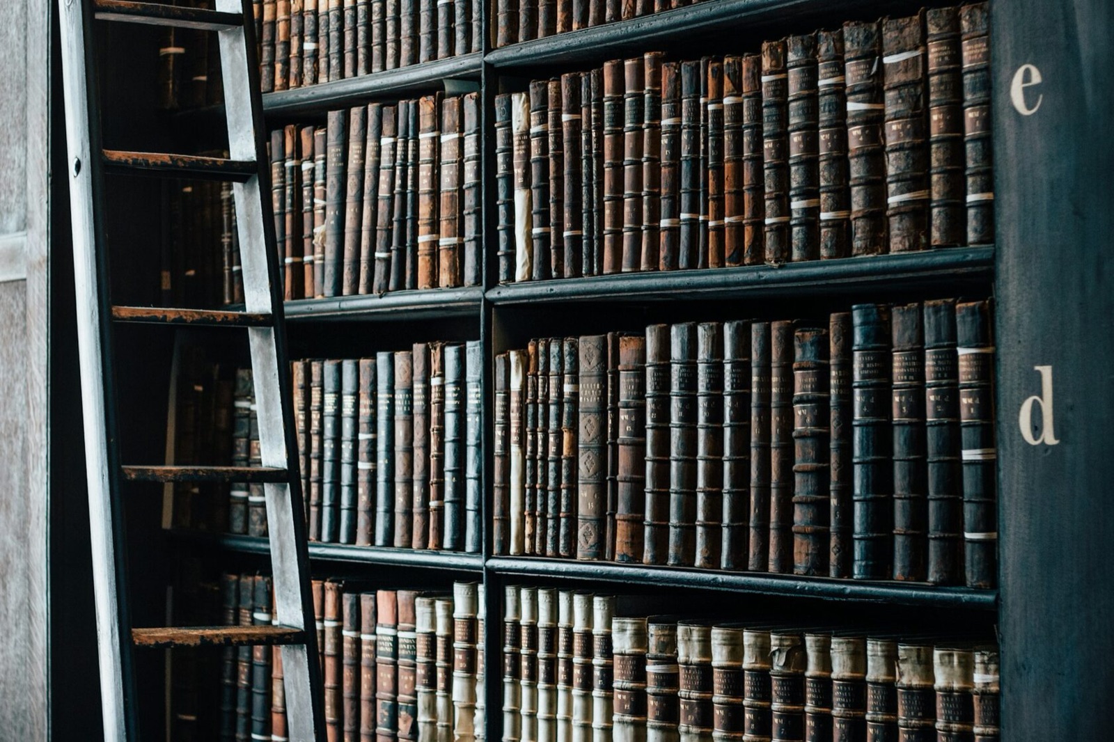 Stack of historical novels on a wooden desk