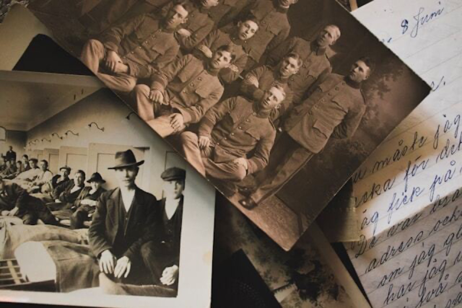Old family photographs and a handwritten ancestral chart