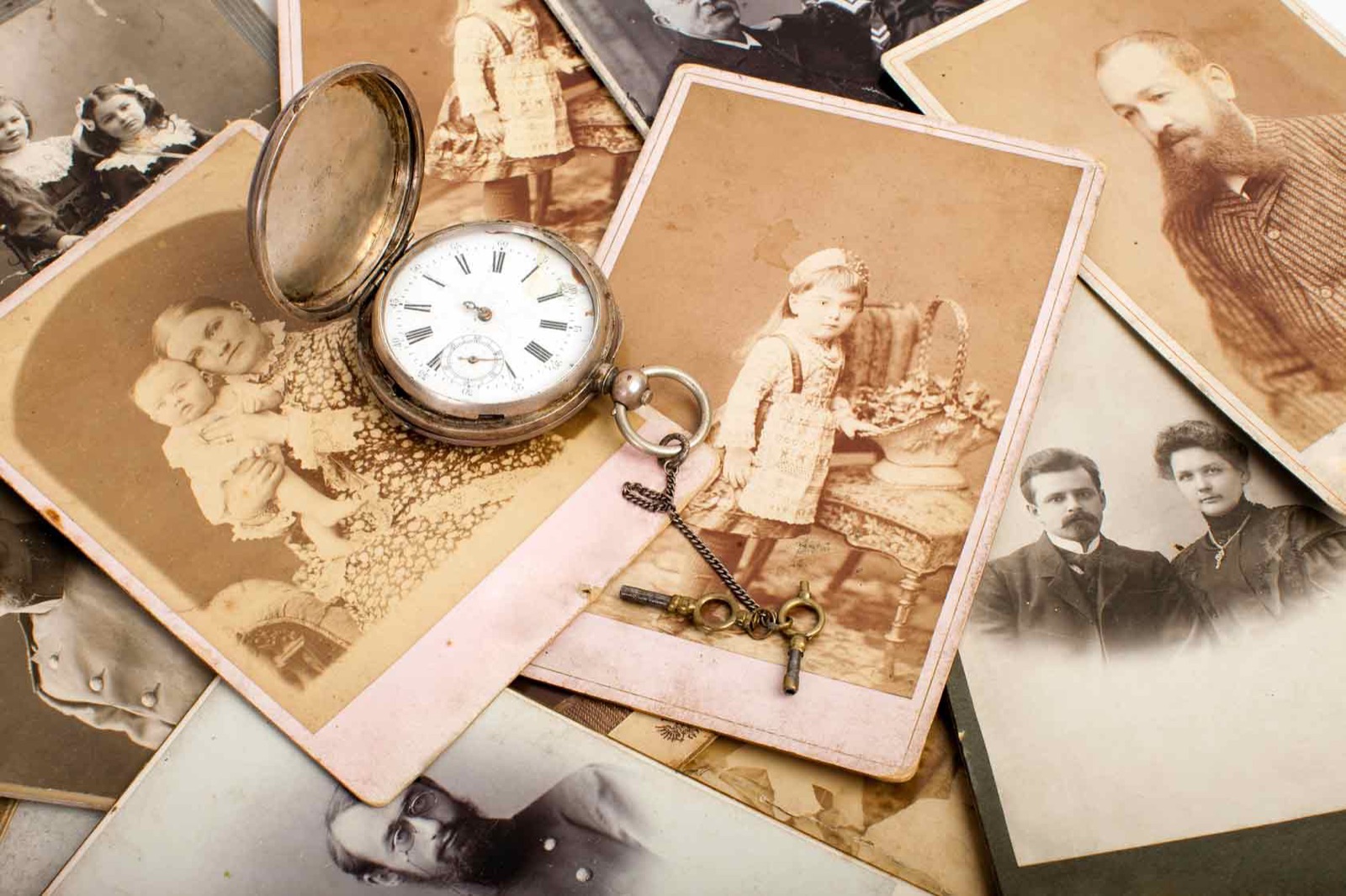 Family book open on a table with archival photographs
